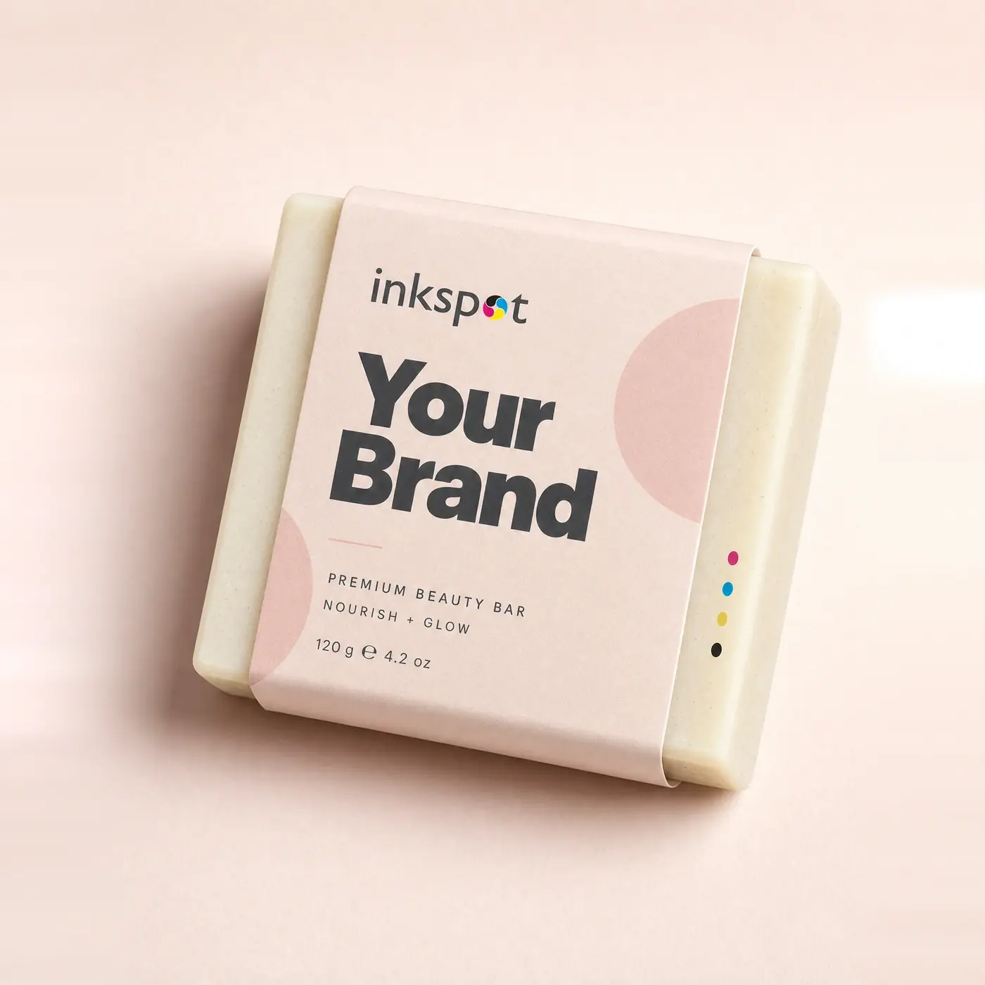 A square printed sleeve carton wrapped around a pale beauty bar.
