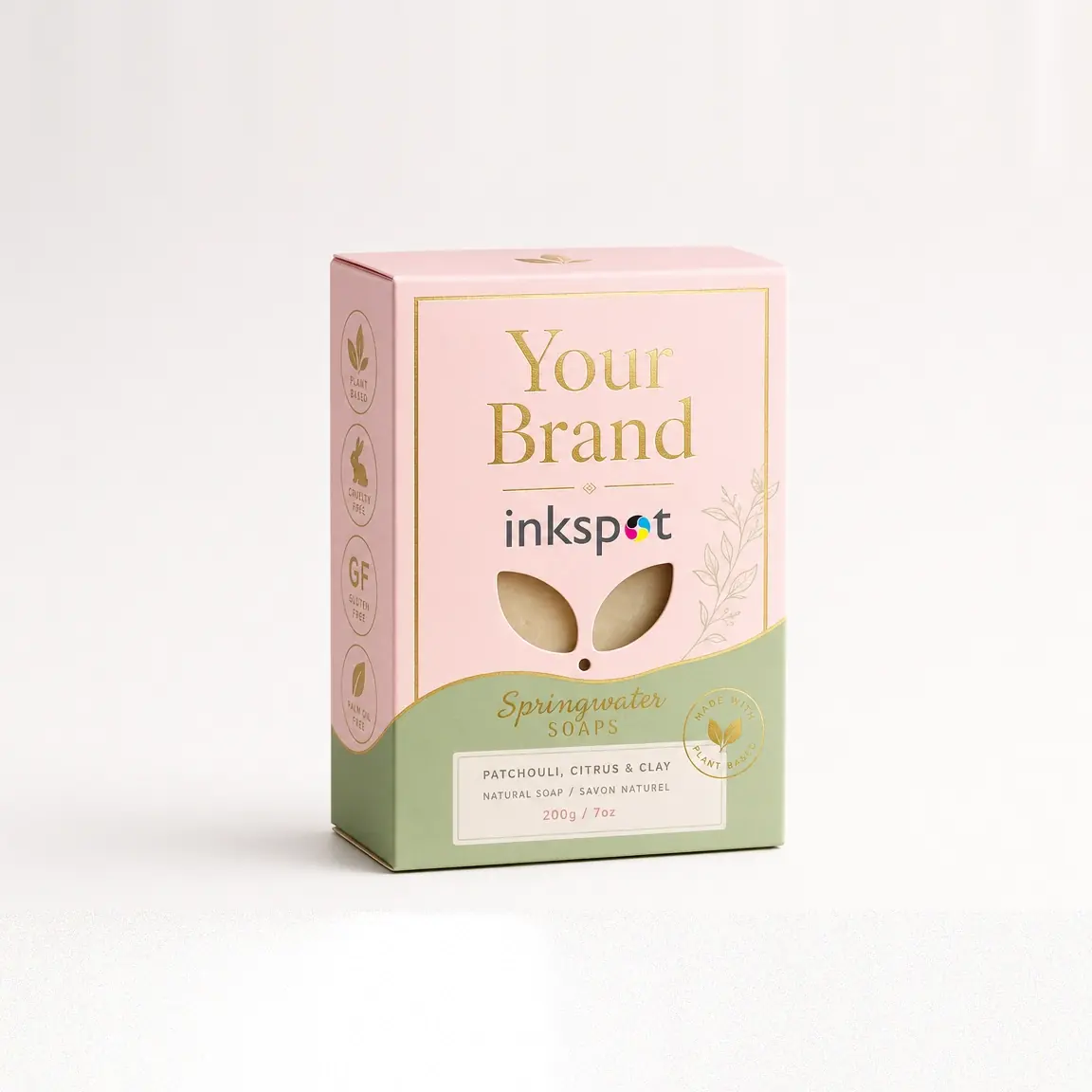 A pink and sage folding carton for a botanical soap, with gold foil lettering.