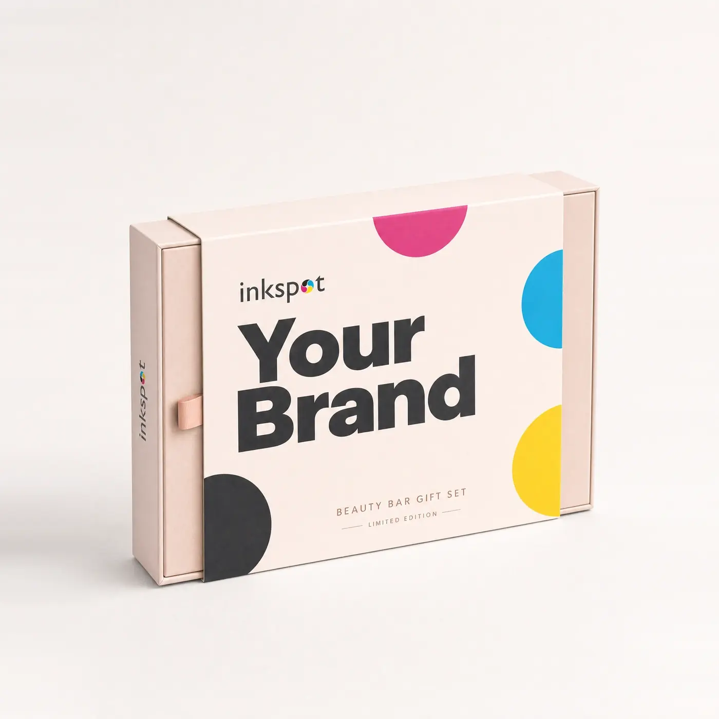 A pink sliding drawer gift box printed with process colour shapes and a pull tab.