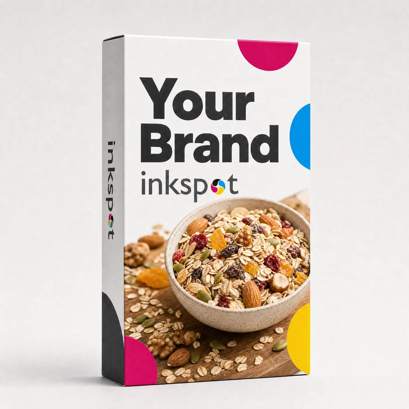 A tall cereal carton with a bowl of muesli photographed across the front panel and process colour shapes bleeding off the edges.