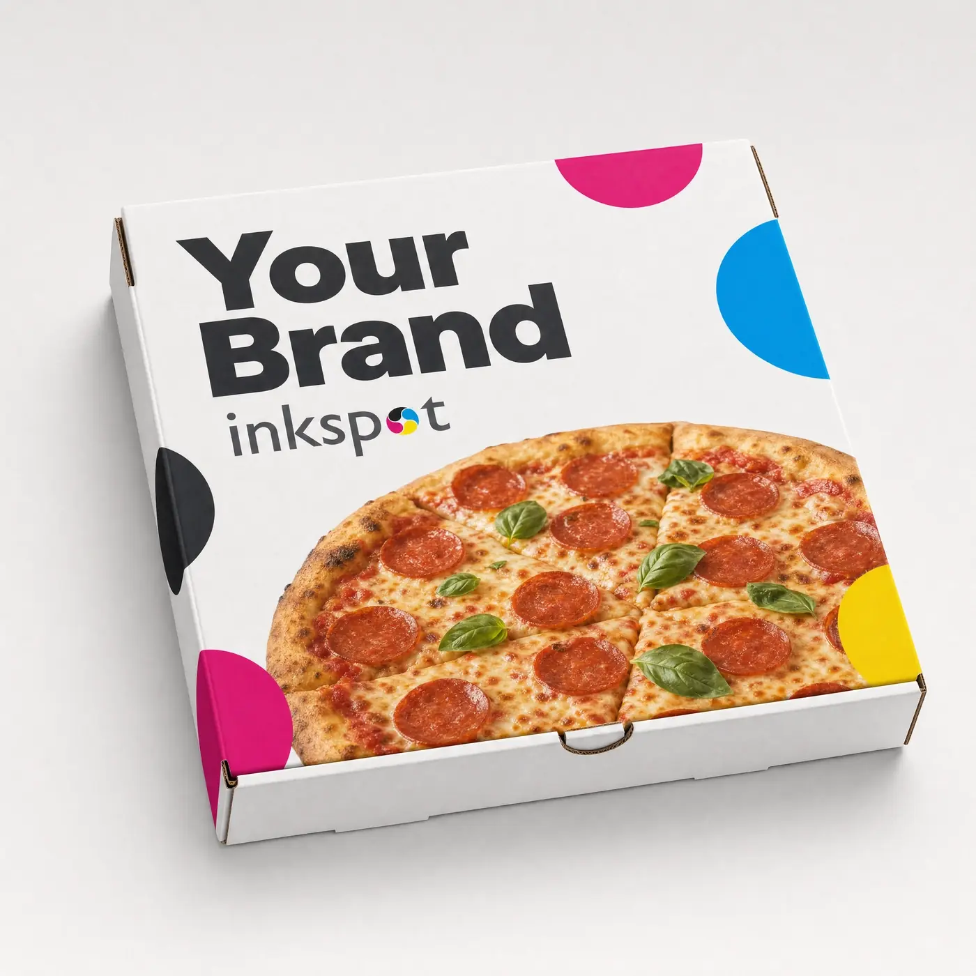 A printed corrugated pizza box photographed closed at an angle.