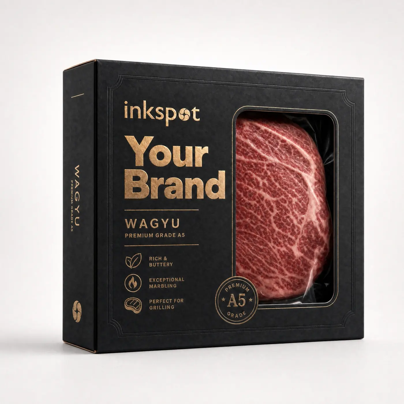 A black premium wagyu carton with gold foil printing and a patched window showing the steak inside.