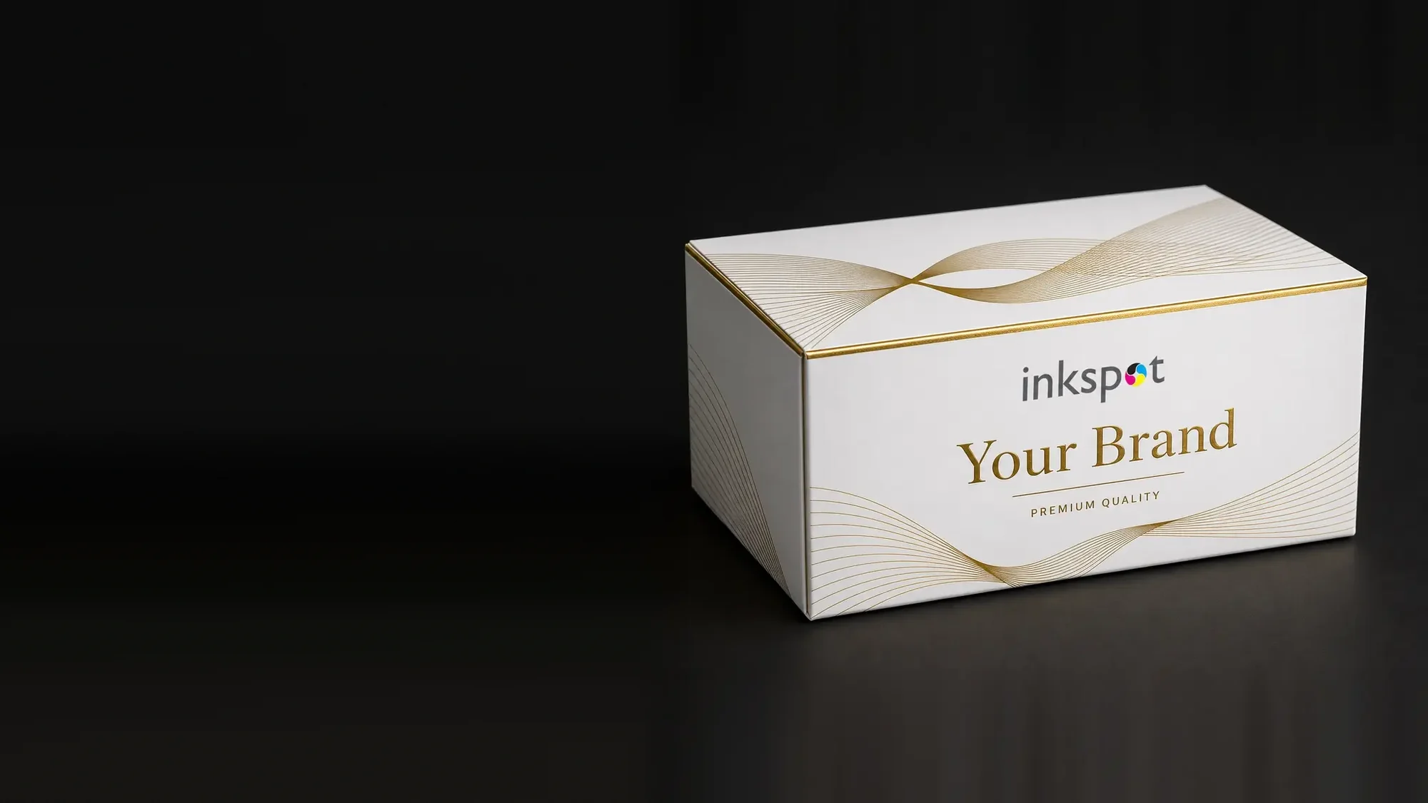 A white shoulder box printed with gold foil ribbons and a foiled rule.