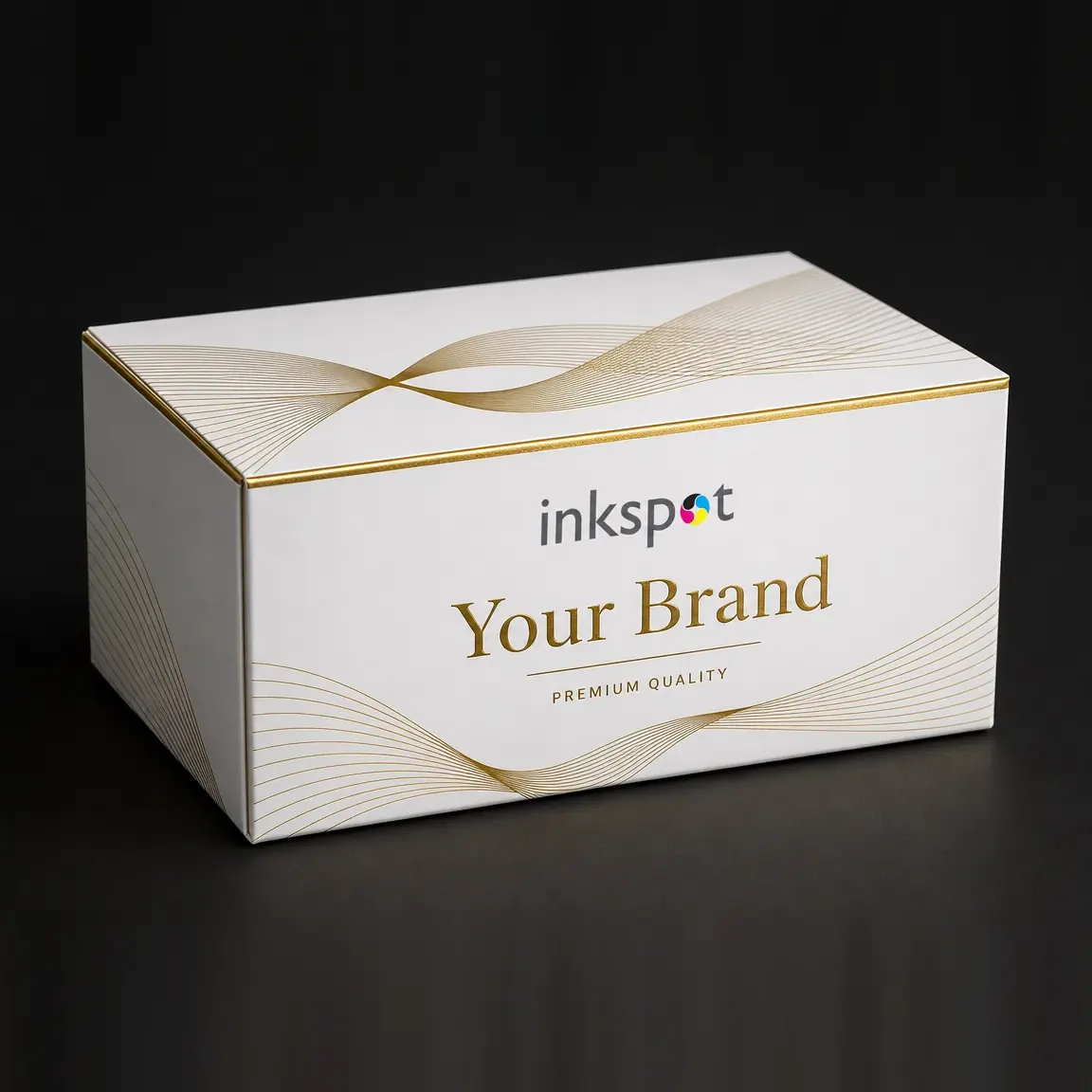 A white shoulder box printed with gold foil ribbons and a foiled rule.